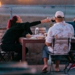 group toasting Urban Legend Wine at our outdoor patio